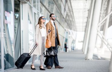Business couple leaving the airport