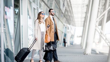 Business couple leaving the airport